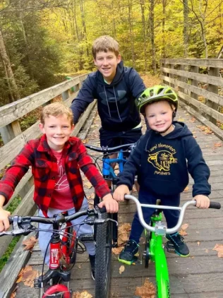 Kids-With-Cycle-in-bridge